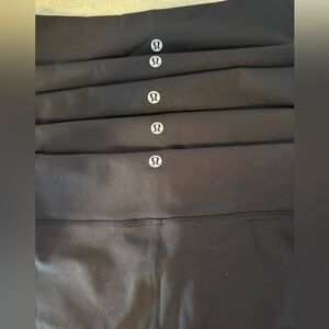 5 pairs used Lululemon mid rise workout pants. All size 10.